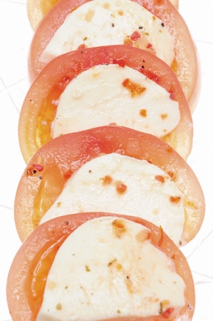 Tomato and mozzarella cheese and salad in white back