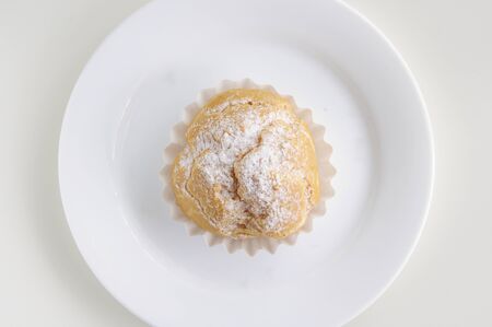Cream puff on the white dish