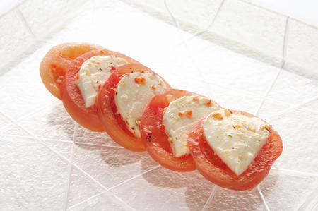 Glass dish tomatoes and mozzarella cheesesaladの写真素材