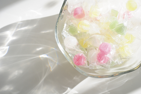 Candy whiskey bonbon that was placed in a glass vessel in the sunshineの写真素材
