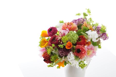 Spring flower of flower arrangements in white back was placed in a vaseの写真素材