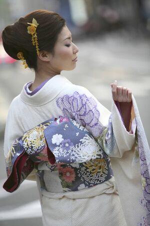 Woman wearing a long-sleeved kimonoの写真素材