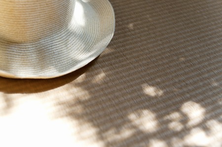 The shadow of the tree falling in the Straw Hatの写真素材