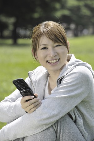 Women Making a mobile phoneの写真素材