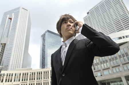 Businessman talking on mobile phoneの写真素材
