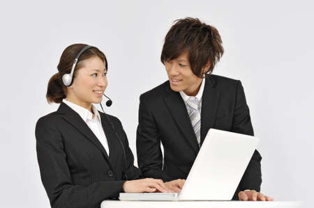 Women operators and young businessmanの写真素材
