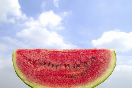 Blue sky and clouds and watermelonの写真素材
