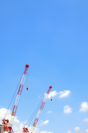 Blue sky and white clouds and a craneの写真素材