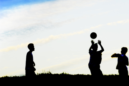 Boys playing with ballの写真素材