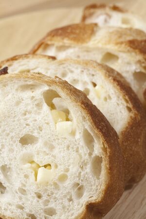 French bread cut with knife.