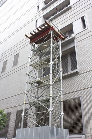 Assembling scaffolding for building renovationの写真素材