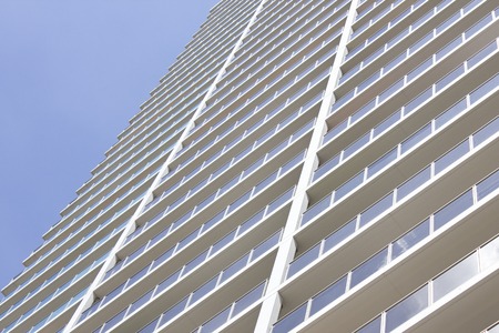 Blue skies and high rise apartment buildings