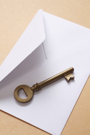 Brass of classic keys and white envelopeの写真素材