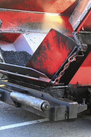 Heavy machinery for asphalt road construction
