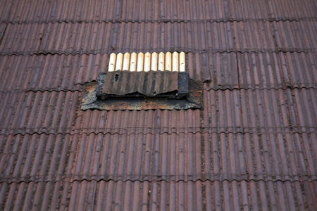 Corrugated iron roof and lighting window rusty warehouse