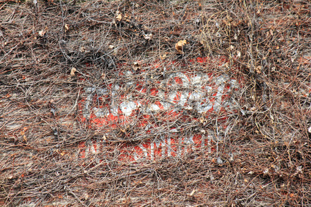 Non smoking sign written on the wall of the warehouseの写真素材