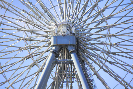 Iron pipe and blue sky of Ferris wheelの写真素材