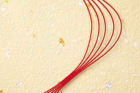 Japanese paper and a red Mizuhiki that contains the gold leafの写真素材