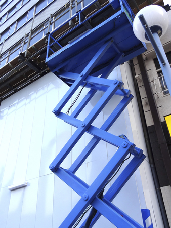 Condominium construction site of aerial work platformsの写真素材