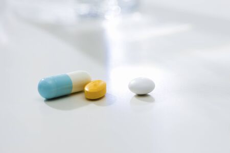 Cup of water and drink drugsの写真素材