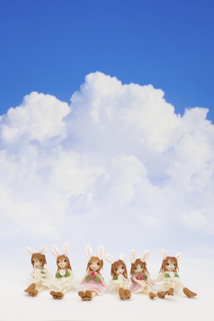 Fellow of blue sky and clouds and a dollの写真素材