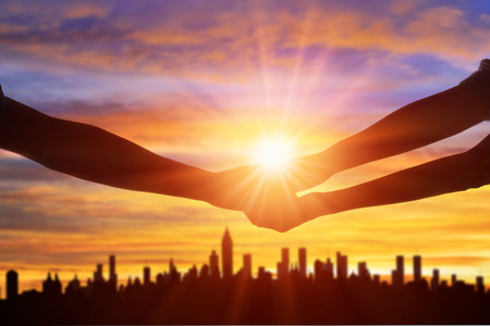 Cityscape silhouette and handの写真素材