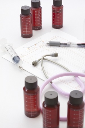 Bottle and stethoscope of chemicalsの写真素材