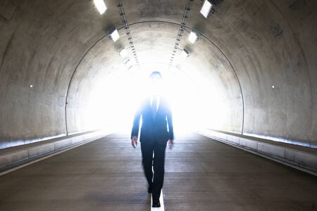 Businessman walking tunnelの写真素材