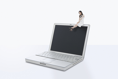 Woman sitting on the laptopの写真素材