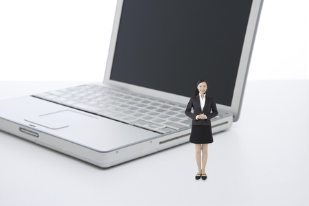 Operator standing in front of a laptopの写真素材
