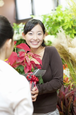 Women who receive the poinsettiaの写真素材