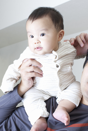 Baby to be lift up to dadの写真素材