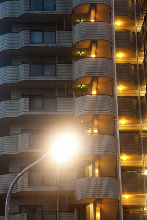 Outdoor light rain and apartmentsの写真素材