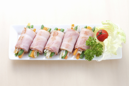 Vegetables wrapped with Baconの写真素材
