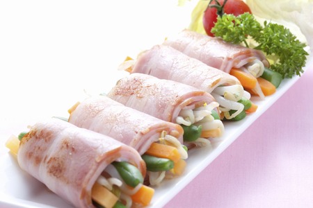 Vegetables wrapped with Baconの写真素材