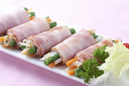 Vegetables wrapped with Baconの写真素材