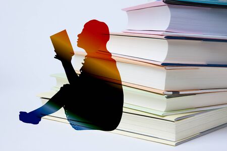 Silhouette of woman readingの写真素材