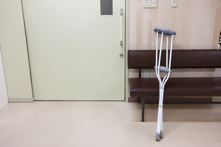 Crutches placed on a chairの写真素材