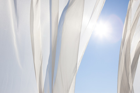 Blue sky and white curtains