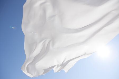 Blue sky and white curtainsの写真素材