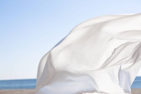 Blue sky and white curtainsの写真素材