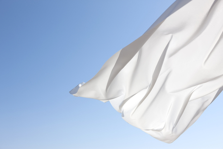 Blue sky and white curtainsの写真素材