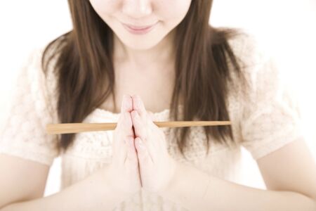 Women with chopsticksの写真素材