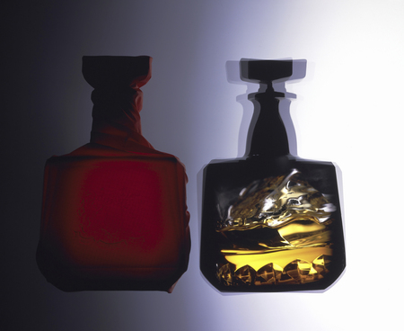 Sizzle of rock glass that was mirrored in the whiskey bottleの写真素材