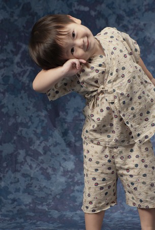 2-year-olds to a cute gesture wearing Jinbeiの写真素材