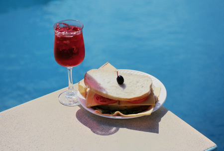 Yes angle the acerola juice and sandwiches by the poolの写真素材