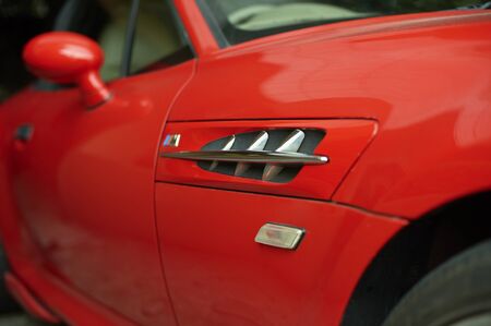 Red car wearing a racing dynamic of the intakeの写真素材