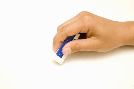 The hands of children that use the eraser