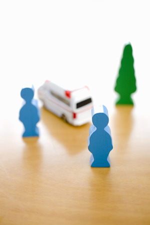 Ambulance and wood dollの写真素材