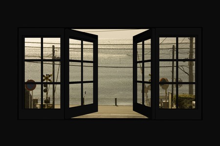 Sea and railroad crossing from window